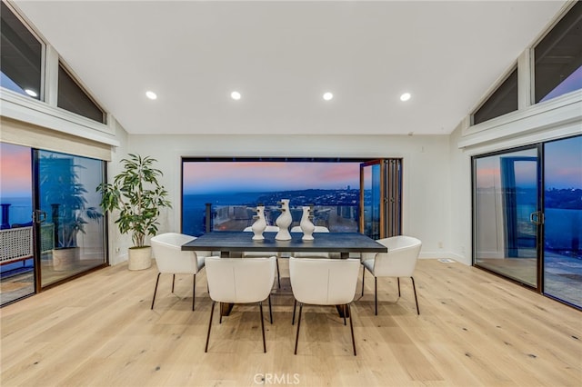 7655 Caminito Avola Ln, Jolla, CA 92037 - dining area with wood finished floors, high vaulted ceiling, recessed lighting, and baseboards
