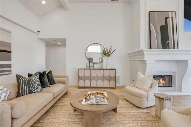 7655 Caminito Avola Ln, Jolla, CA 92037 - living room featuring beamed ceiling, wood finished floors, a fireplace, recessed lighting, and high vaulted ceiling