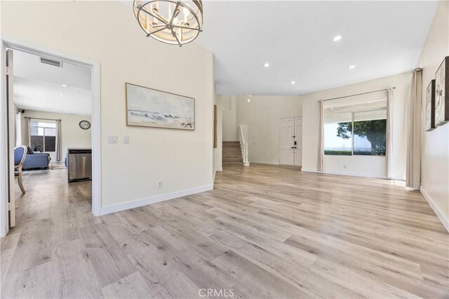 18680 Vantage Pointe Dr, Rowland Heights, CA 91748 - unfurnished living room featuring light wood-style flooring, recessed lighting, baseboards, and a chandelier