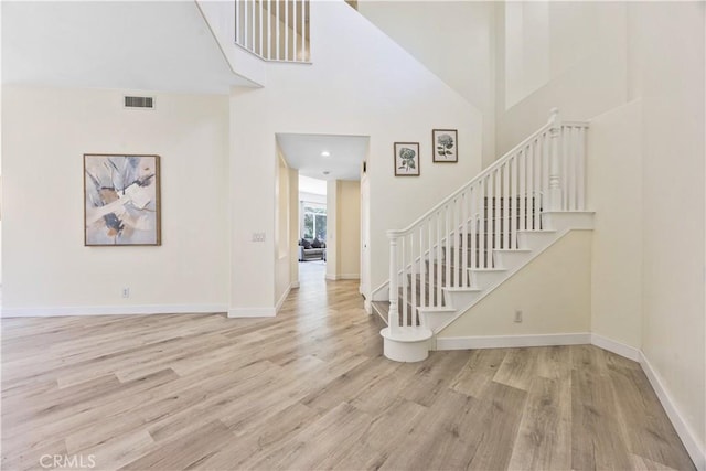 18680 Vantage Pointe Dr, Rowland Heights, CA 91748 - entryway with wood finished floors, baseboards, stairs, and a towering ceiling