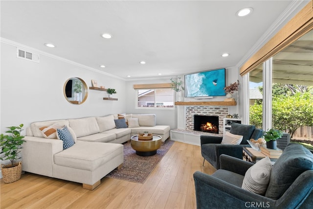 12921 Eveningside Dr, North Tustin, CA 92705 - living room featuring crown molding, recessed lighting, light wood-style floors, and a brick fireplace