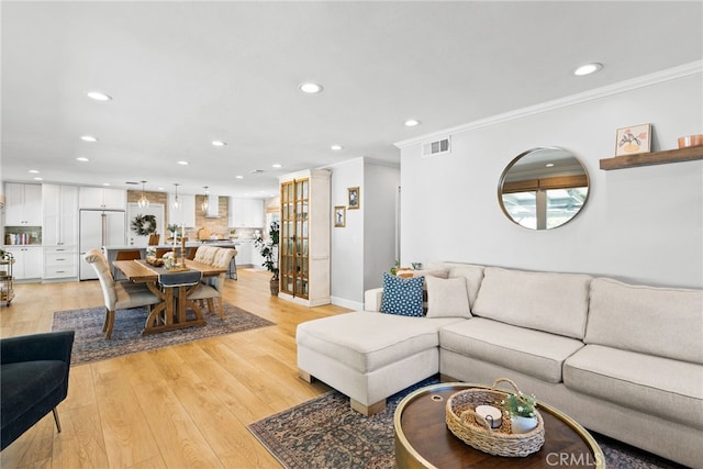 12921 Eveningside Dr, North Tustin, CA 92705 - living area featuring recessed lighting, ornamental molding, light wood finished floors, and baseboards