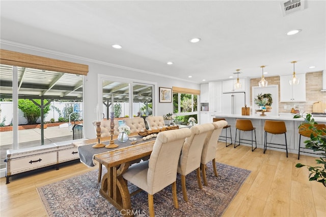 12921 Eveningside Dr, North Tustin, CA 92705 - dining room featuring recessed lighting, light wood-style floors, and ornamental molding