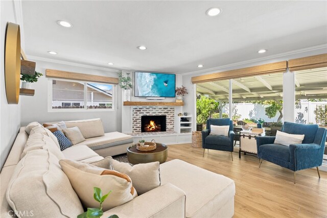 12921 Eveningside Dr, North Tustin, CA 92705 - living area featuring ornamental molding, light wood-type flooring, a fireplace, and recessed lighting