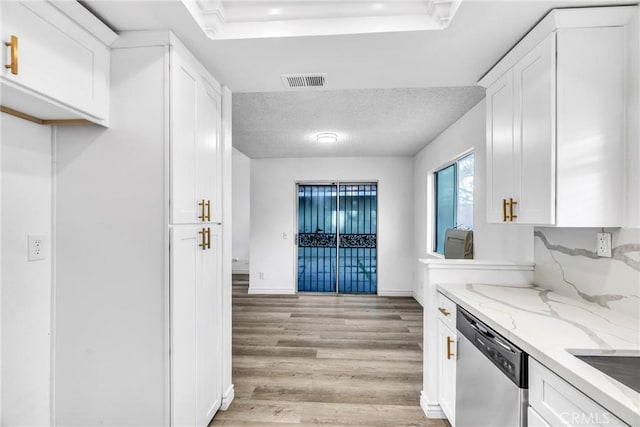 15696 Paine St, Fontana, CA 92336 - kitchen featuring dishwasher, light wood-style floors, white cabinets, light stone counters, and baseboards