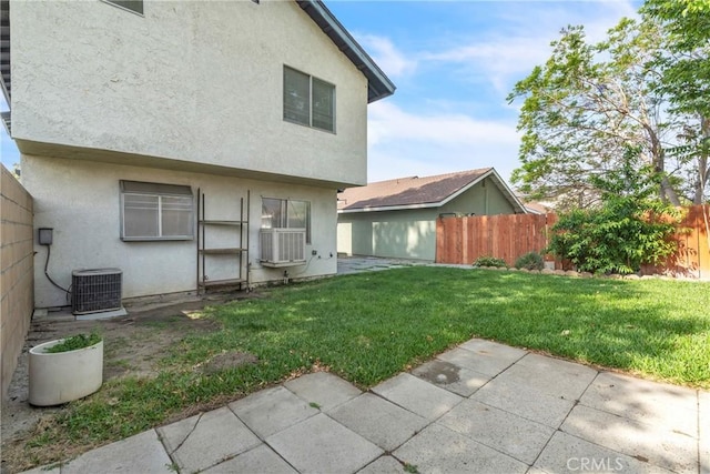 15696 Paine St, Fontana, CA 92336 - back of house with stucco siding, cooling unit, and a patio