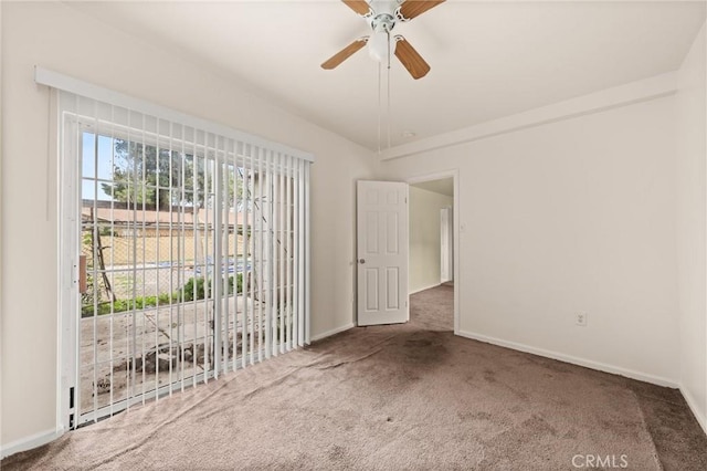 1009 E Peck St, Compton, CA 90221 - carpeted spare room with baseboards and ceiling fan