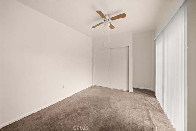 1009 E Peck St, Compton, CA 90221 - unfurnished bedroom with carpet, ceiling fan, a closet, and baseboards