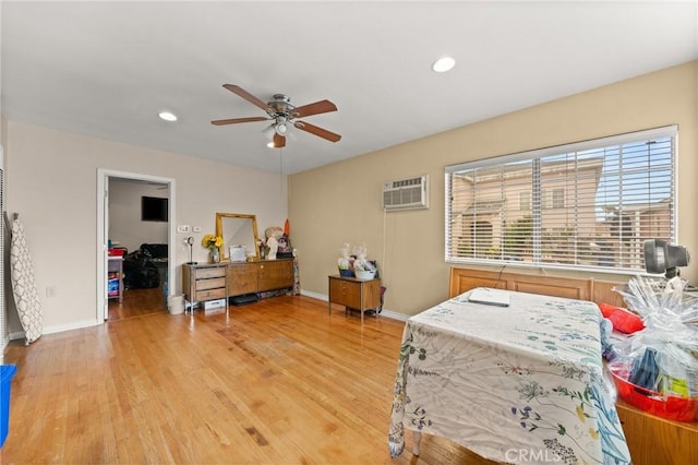 1009 E Peck St, Compton, CA 90221 - bedroom featuring light wood-style flooring, baseboards, recessed lighting, ceiling fan, and a wall unit AC