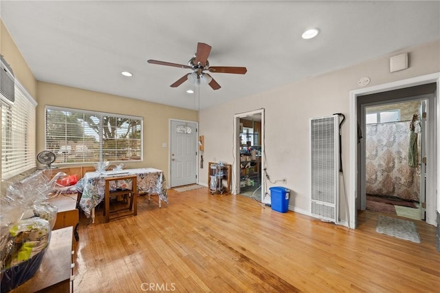1009 E Peck St, Compton, CA 90221 - living room featuring a heating unit, ceiling fan, light wood-style floors, baseboards, and recessed lighting