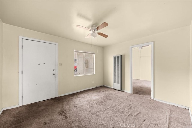1009 E Peck St, Compton, CA 90221 - unfurnished bedroom with a heating unit, carpet flooring, baseboards, and a ceiling fan