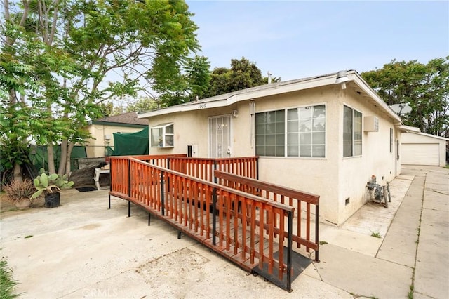 1009 E Peck St, Compton, CA 90221 - view of front of property featuring stucco siding and a deck
