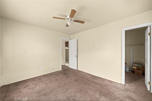 1009 E Peck St, Compton, CA 90221 - unfurnished bedroom featuring a walk in closet, carpet flooring, a closet, and ceiling fan