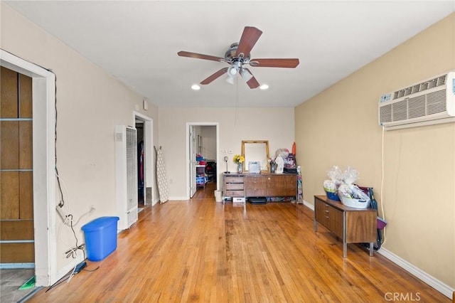 1009 E Peck St, Compton, CA 90221 - bedroom featuring a wall unit AC, a heating unit, wood finished floors, recessed lighting, and baseboards