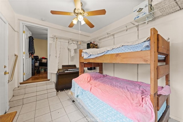1009 E Peck St, Compton, CA 90221 - tiled bedroom with a ceiling fan