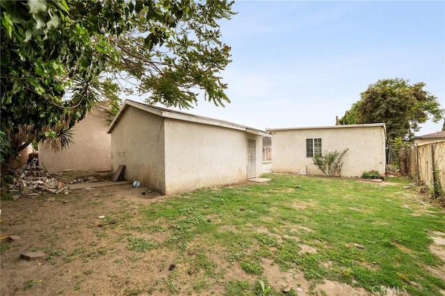 1009 E Peck St, Compton, CA 90221 - rear view of house featuring stucco siding
