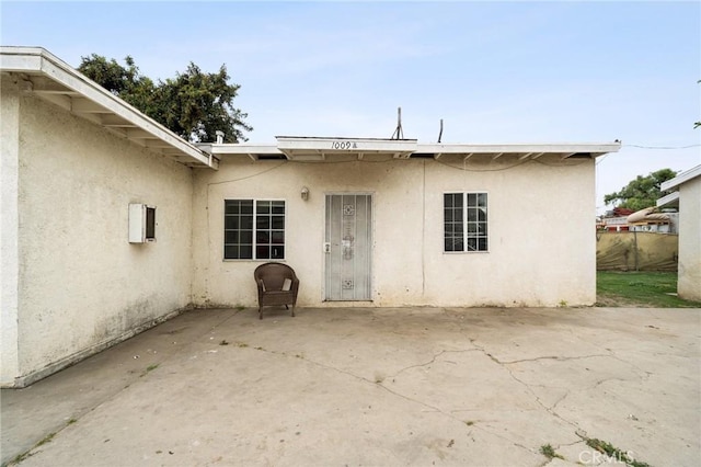 1009 E Peck St, Compton, CA 90221 - property entrance with stucco siding and a patio