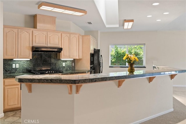43 Edgewater Ct, Chico, CA 95928 - kitchen featuring light brown cabinets, under cabinet range hood, a kitchen bar, and recessed lighting