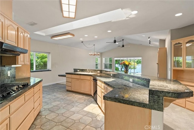 43 Edgewater Ct, Chico, CA 95928 - kitchen with light brown cabinetry, black appliances, vaulted ceiling, backsplash, and ceiling fan