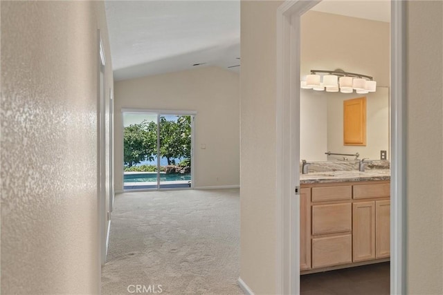 43 Edgewater Ct, Chico, CA 95928 - corridor featuring vaulted ceiling and carpet
