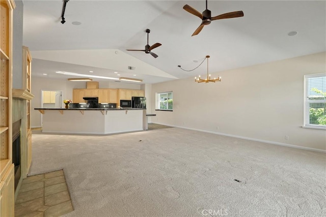 43 Edgewater Ct, Chico, CA 95928 - unfurnished living room with ceiling fan, lofted ceiling, light carpet, a chandelier, and a fireplace