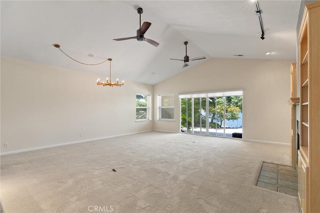 43 Edgewater Ct, Chico, CA 95928 - unfurnished living room with carpet floors, ceiling fan, a chandelier, high vaulted ceiling, and rail lighting