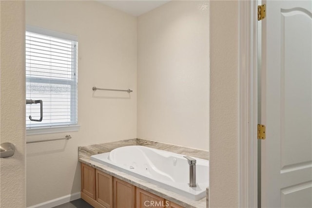 43 Edgewater Ct, Chico, CA 95928 - bathroom with a jetted tub and baseboards