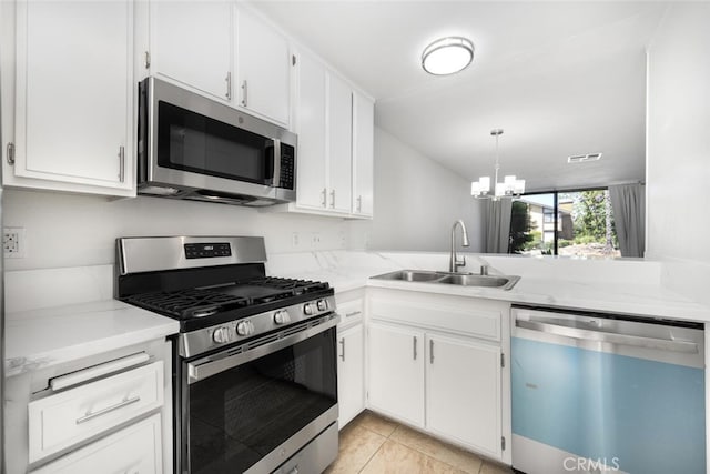 12750 Centralia St Unit 208, Lakewood, CA 90715 - kitchen featuring stainless steel appliances, a sink, a chandelier, white cabinets, and light tile patterned floors