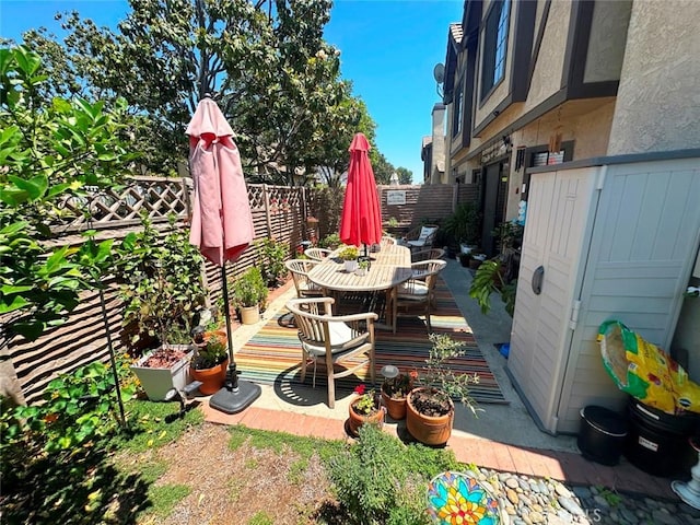 4909 New Castle Ln Unit A, Covina, CA 91724 - wooden terrace with outdoor dining area and a fenced backyard