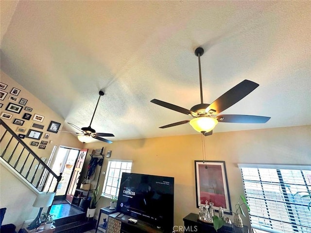 4909 New Castle Ln Unit A, Covina, CA 91724 - living area featuring a ceiling fan, a textured ceiling, stairway, and lofted ceiling