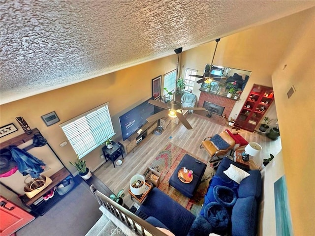 4909 New Castle Ln Unit A, Covina, CA 91724 - living area with ceiling fan, wood finished floors, and a textured ceiling