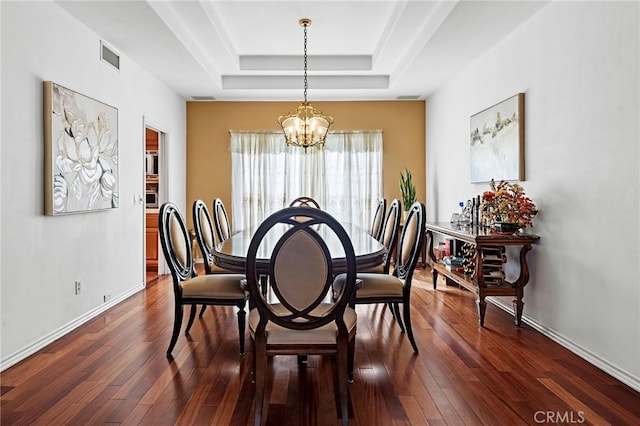 1036 Alpine Ct, Chino Hills, CA 91709 - dining area with a raised ceiling, a chandelier, dark wood-style flooring, and baseboards