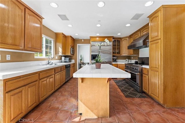 1036 Alpine Ct, Chino Hills, CA 91709 - kitchen featuring range hood, high end appliances, a sink, tile counters, and a kitchen island