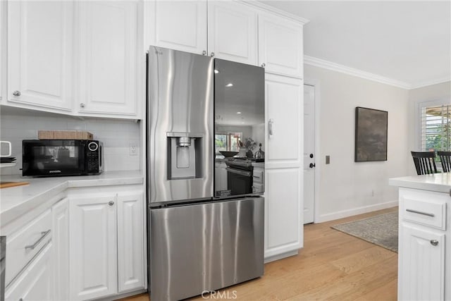 5839 Parkmor Rd, Calabasas, CA 91302 - kitchen featuring stainless steel refrigerator with ice dispenser, black microwave, ornamental molding, light wood-style flooring, and backsplash