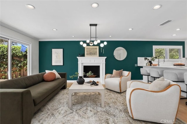 5839 Parkmor Rd, Calabasas, CA 91302 - living area featuring recessed lighting, wood finished floors, crown molding, and a fireplace