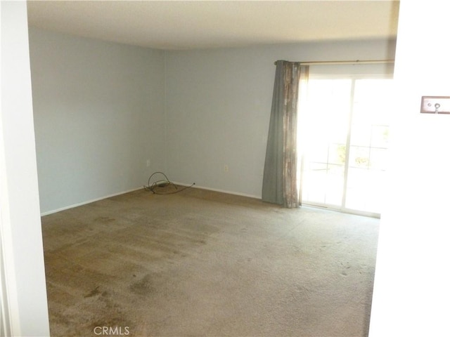 26223 Crestone Dr, Menifee, CA 92586 - carpeted empty room featuring plenty of natural light and baseboards