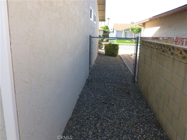 26223 Crestone Dr, Menifee, CA 92586 - view of side of home featuring stucco siding