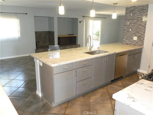 26223 Crestone Dr, Menifee, CA 92586 - kitchen with a sink, gray cabinetry, hanging light fixtures, and baseboards