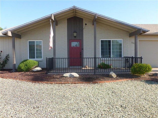 26223 Crestone Dr, Menifee, CA 92586 - single story home with an attached garage, brick siding, covered porch, and driveway