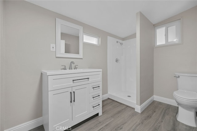 4875 Fairway Blvd, Chino Hills, CA 91709 - full bath featuring toilet, a walk in shower, wood finished floors, vanity, and vaulted ceiling