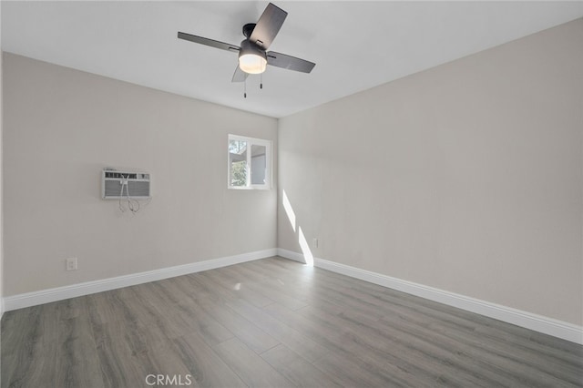 4875 Fairway Blvd, Chino Hills, CA 91709 - empty room with wood finished floors, ceiling fan, baseboards, and a wall unit AC