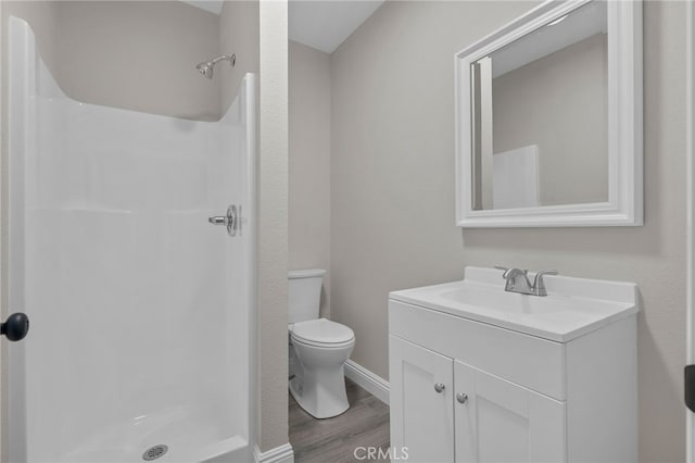 4875 Fairway Blvd, Chino Hills, CA 91709 - bathroom with toilet, a shower stall, wood finished floors, vanity, and baseboards