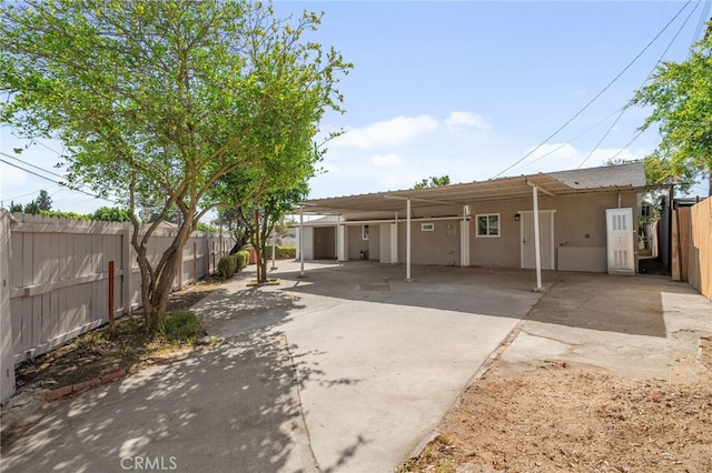 4875 Fairway Blvd, Chino Hills, CA 91709 - view of front of home with stucco siding, fence, concrete driveway, and a carport