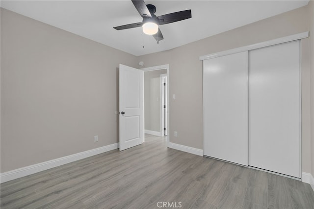 4875 Fairway Blvd, Chino Hills, CA 91709 - unfurnished bedroom featuring wood finished floors, a closet, baseboards, and a ceiling fan