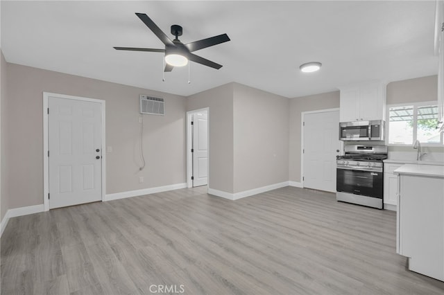 4875 Fairway Blvd, Chino Hills, CA 91709 - kitchen with appliances with stainless steel finishes, baseboards, light wood-style floors, and light countertops
