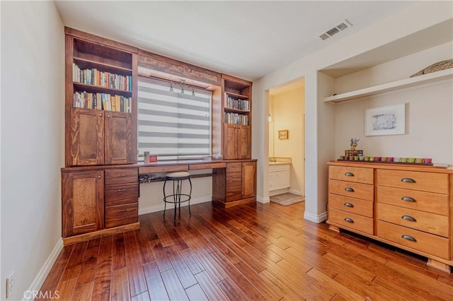 2101 S Sanders Ct, La Habra, CA 90631 - office area with built in study area, hardwood / wood-style flooring, baseboards, and built in shelves