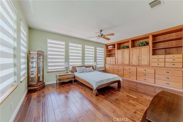 2101 S Sanders Ct, La Habra, CA 90631 - bedroom featuring multiple windows, baseboards, wood finished floors, and ceiling fan