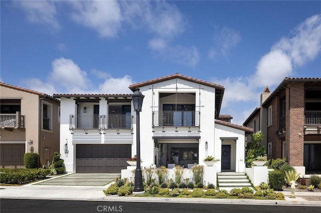 135 Via Artemesia, San Clemente, CA 92672 - mediterranean / spanish house with a balcony, concrete driveway, stucco siding, a tiled roof, and a garage