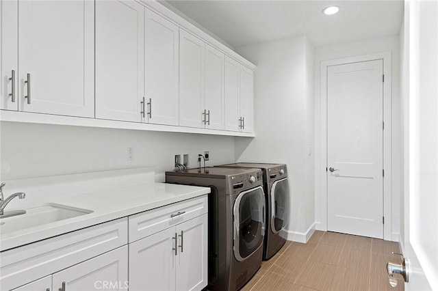 135 Via Artemesia, San Clemente, CA 92672 - laundry area with cabinet space, washer and dryer, recessed lighting, and baseboards
