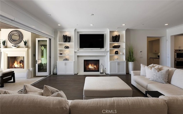 135 Via Artemesia, San Clemente, CA 92672 - living room with a warm lit fireplace, crown molding, recessed lighting, and dark wood-style floors